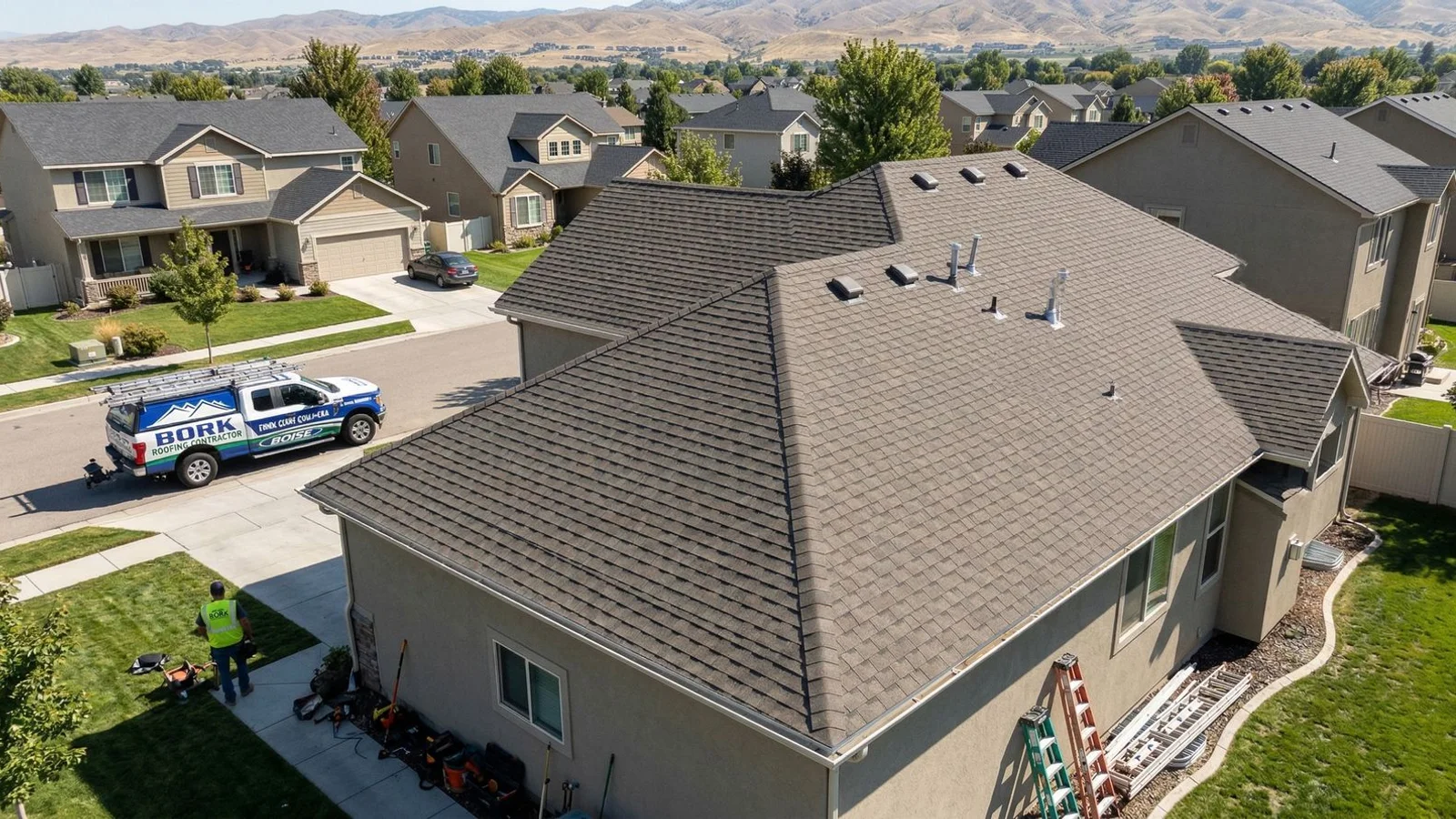 Aerial view of a newly installed architectural asphalt shingle roof on a Boise Bench home